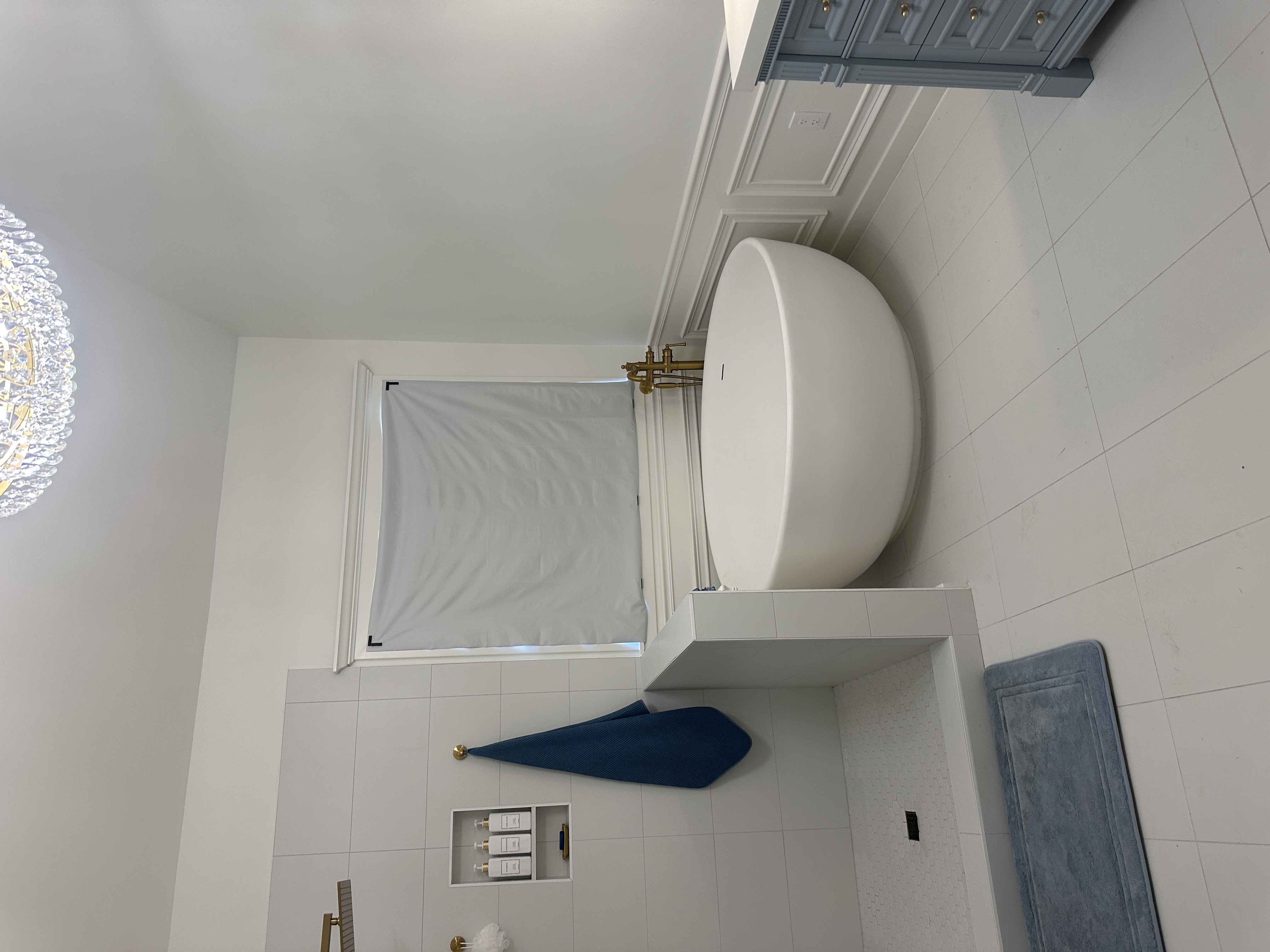 Finished bathroom with painted trim and freestanding tub